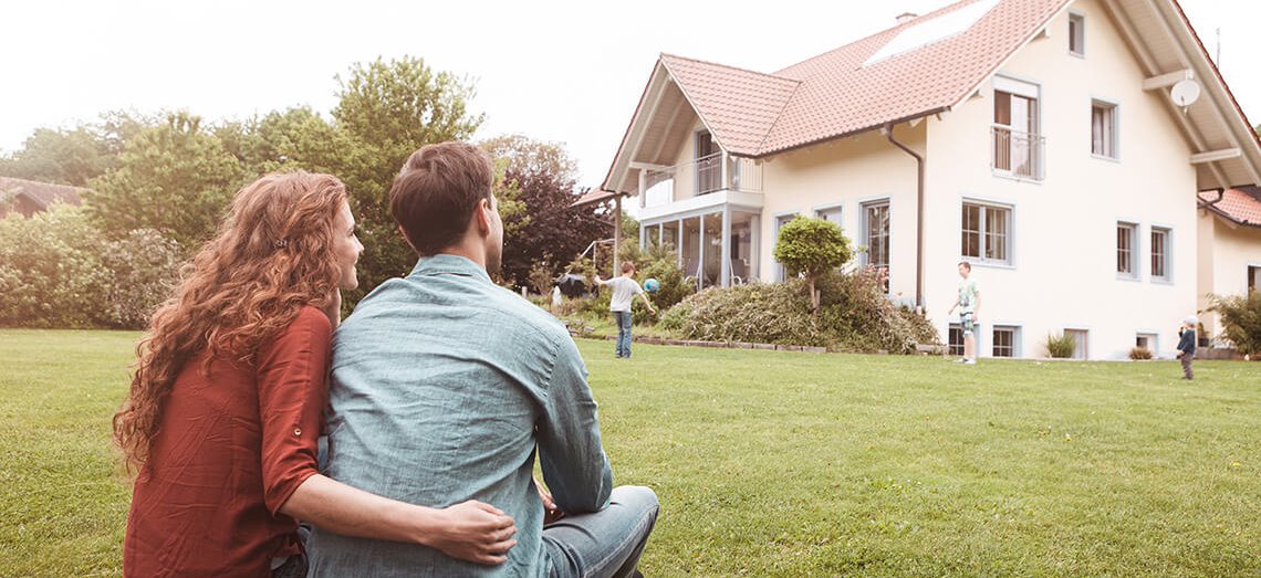 A couple watches their children play and dream of the financially sound future they are building for their children and their own retirement.
