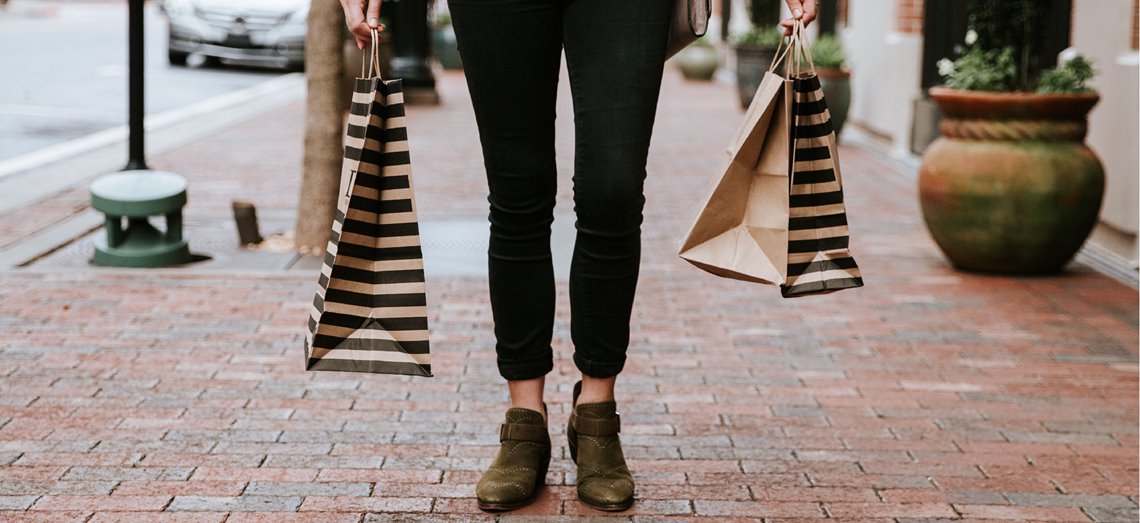 A shopper is shown with her many retail purchases; she likewise should have many options when choosing investments.