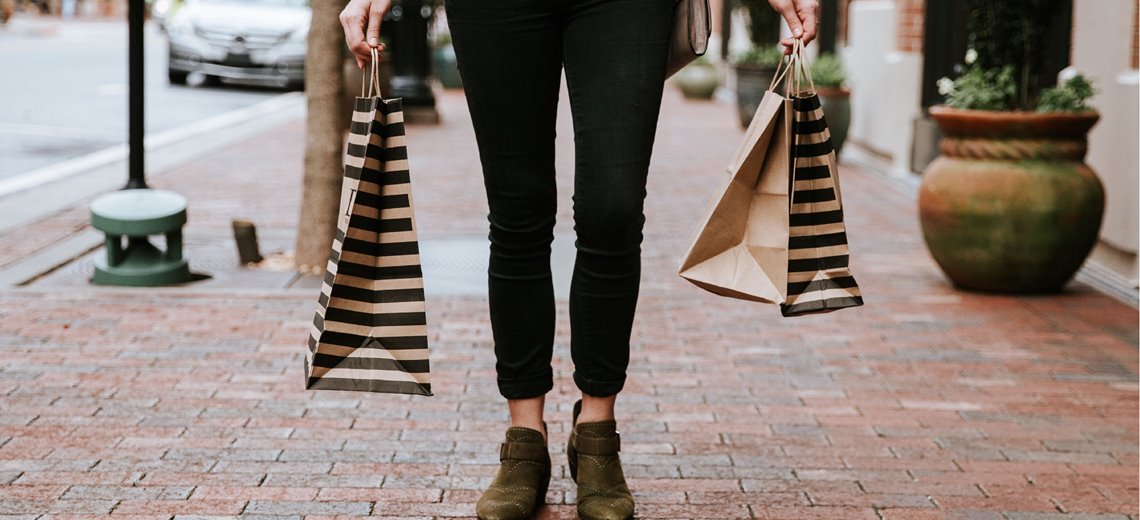 A shopper is shown with her many retail purchases; she likewise should have many options when choosing investments.