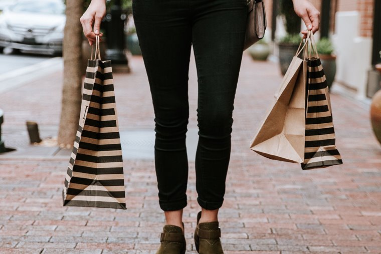 A shopper is shown with her many retail purchases; she likewise should have many options when choosing investments.