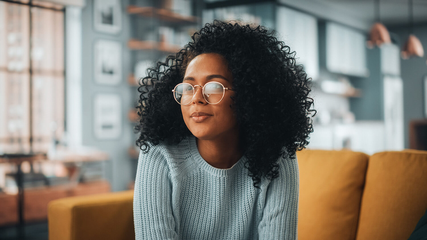 Young super saver couple lounging together in their home.